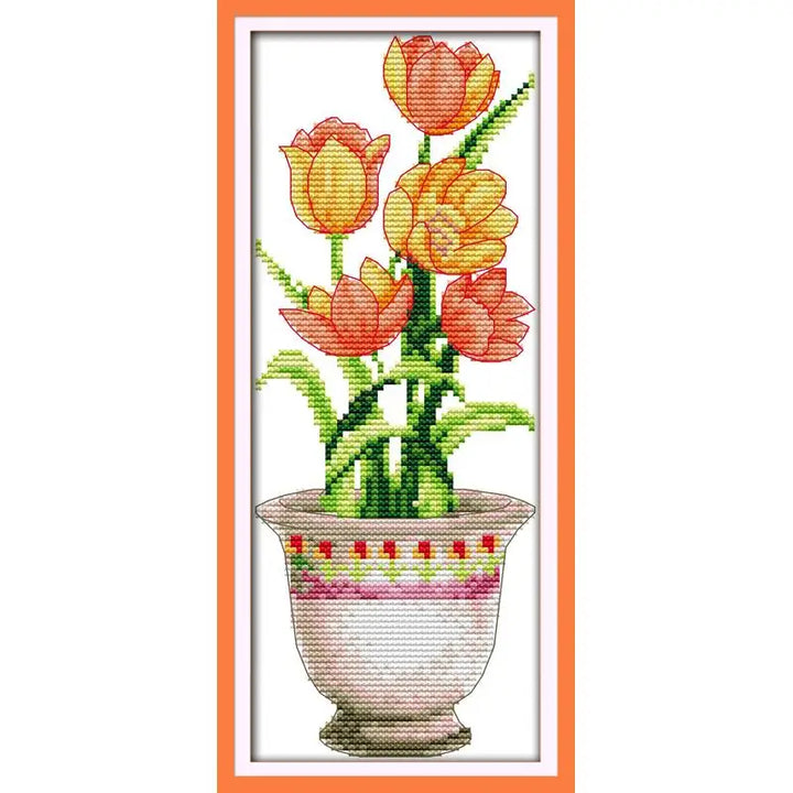 Cross-stitched design of tulips in a pot with an orange border