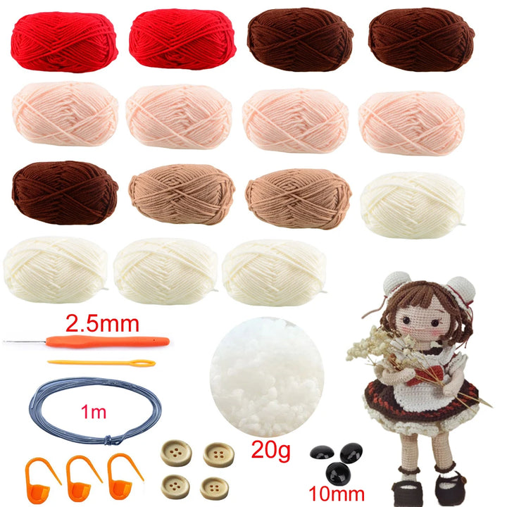 Collection of yarn balls, crochet hook, and a knitted doll on a white background