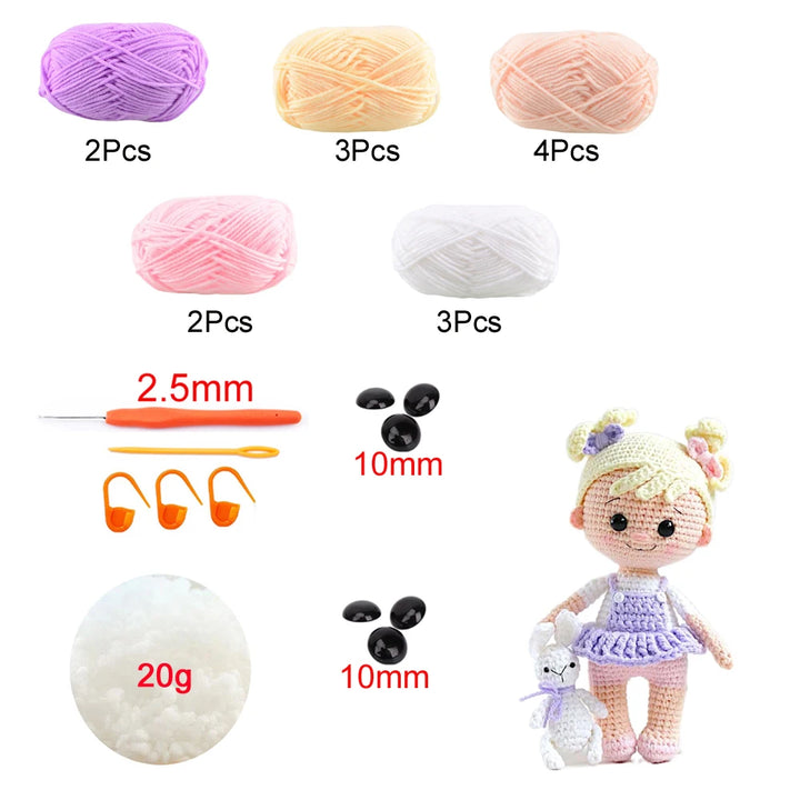 Collection of yarn balls, crochet hooks, and a small doll on a white background
