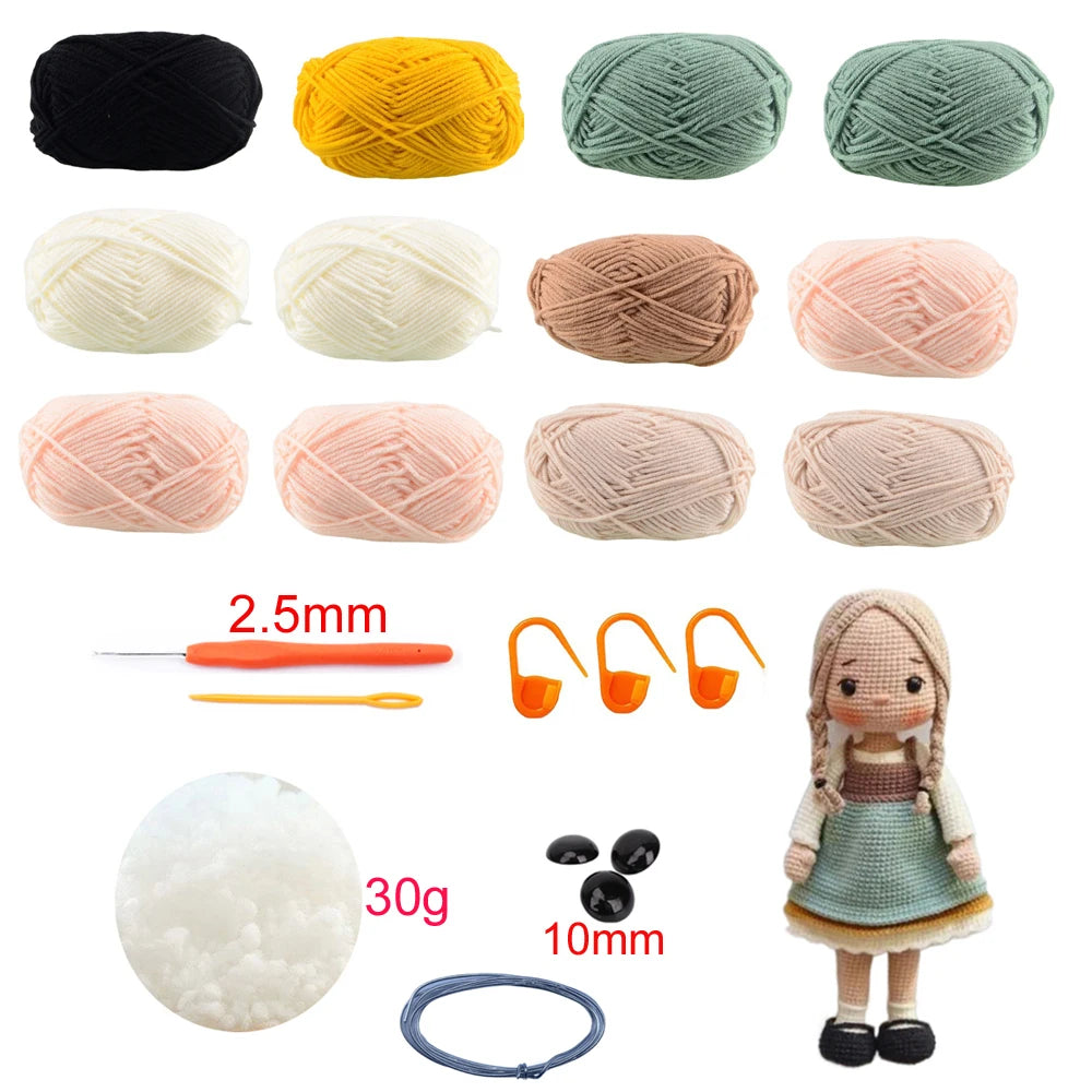Collection of yarn balls in various colors with knitting tools and a doll on a white background