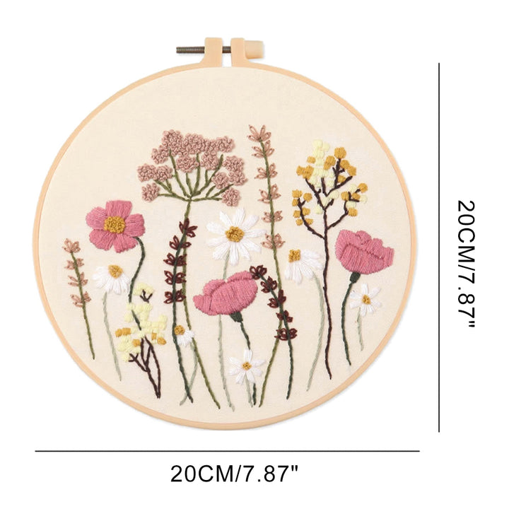 Embroidery hoop with floral design and dimensions on a white background