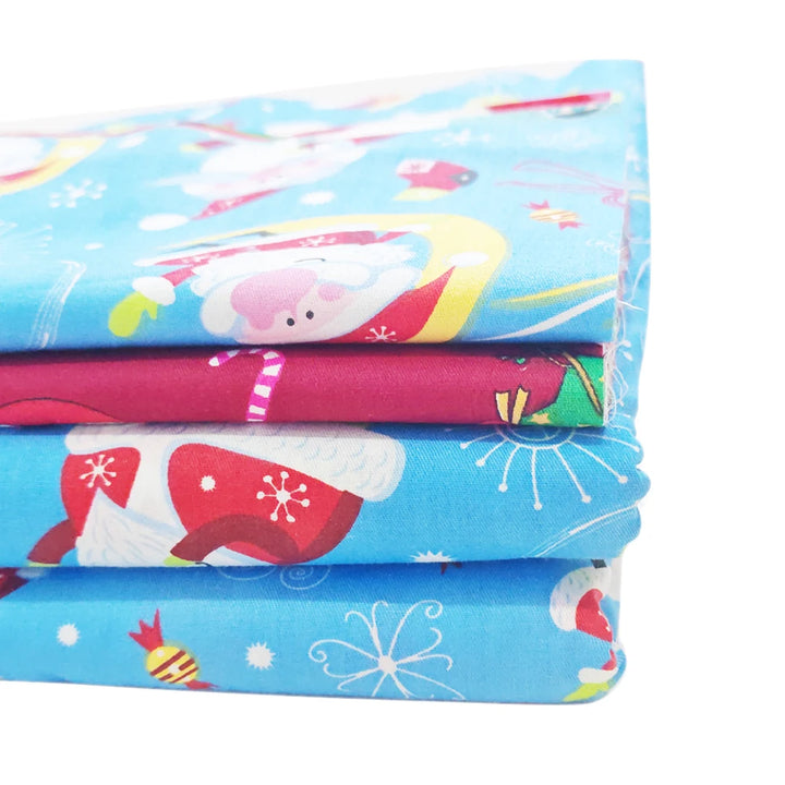 Stack of colorful fabric sheets with cartoon designs on a white background