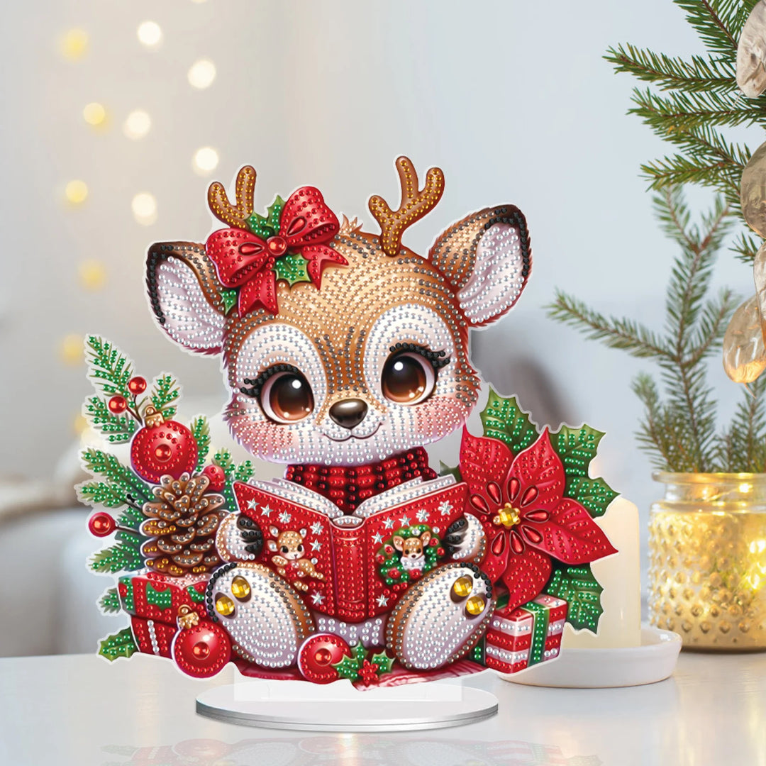 Decorative reindeer figure with Christmas elements on a white surface.