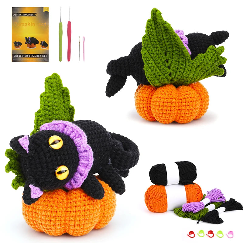 Crocheted pumpkins with bats and candy corn, accompanied by crochet hooks and yarn, on a white background.