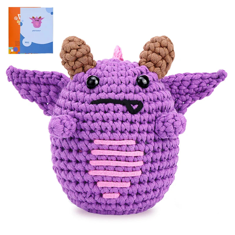 Purple crochet toy with brown horns on a white background