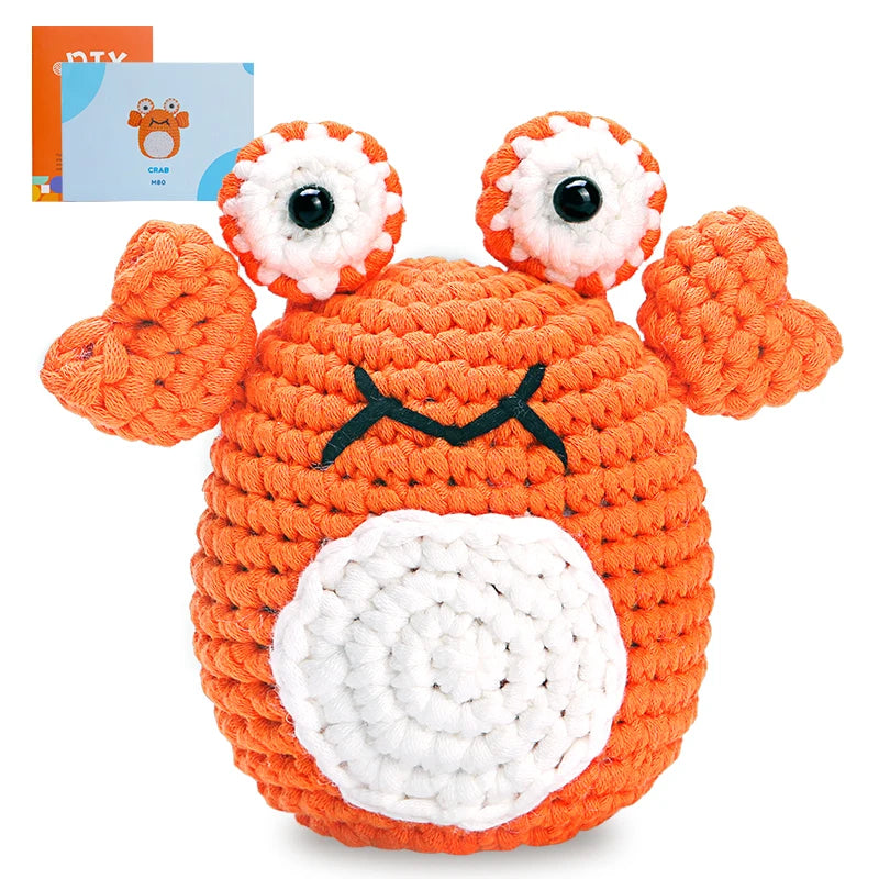 Crocheted crab toy with a white background