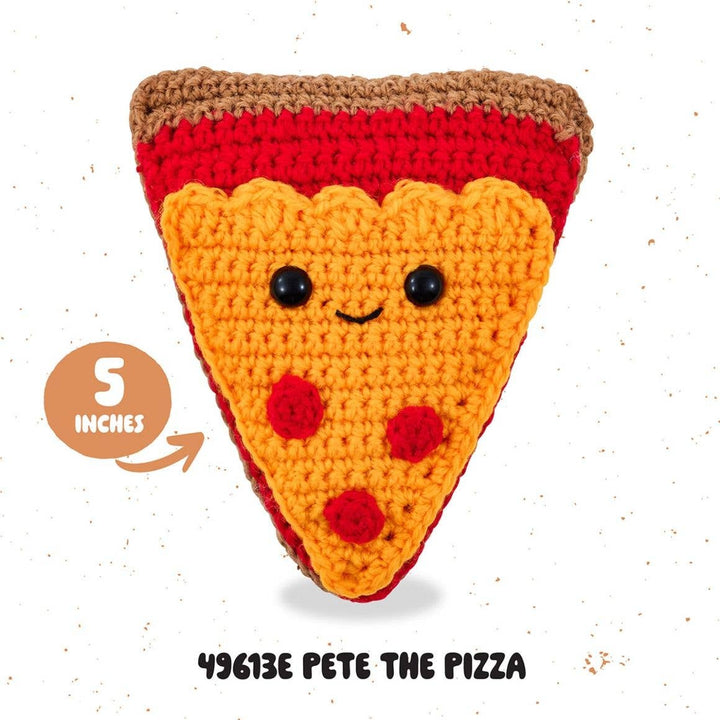 Crocheted pizza slice toy with a smiley face on a white background