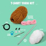 T-shirt yarn kit with various crafting items on a green background