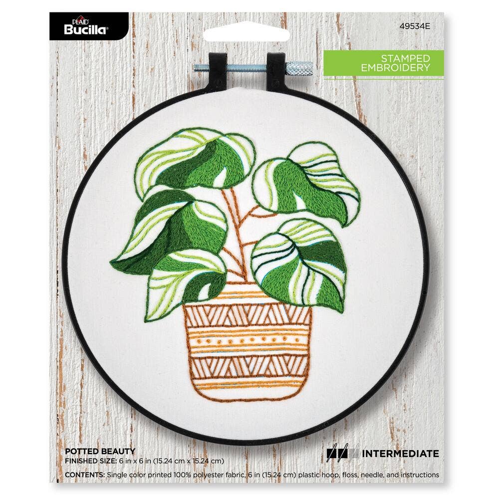 Embroidery hoop with potted plant design on a white background, featuring Bucilla branding.