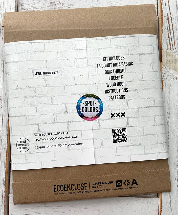 Kraft paper package with white brick patterned label and Spot Colors branding.